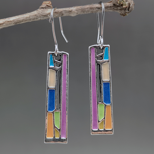 Art Deco-style earrings featuring colourful enamel geometric designs