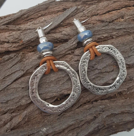 Handmade earrings with blue glass beads and leather detailing