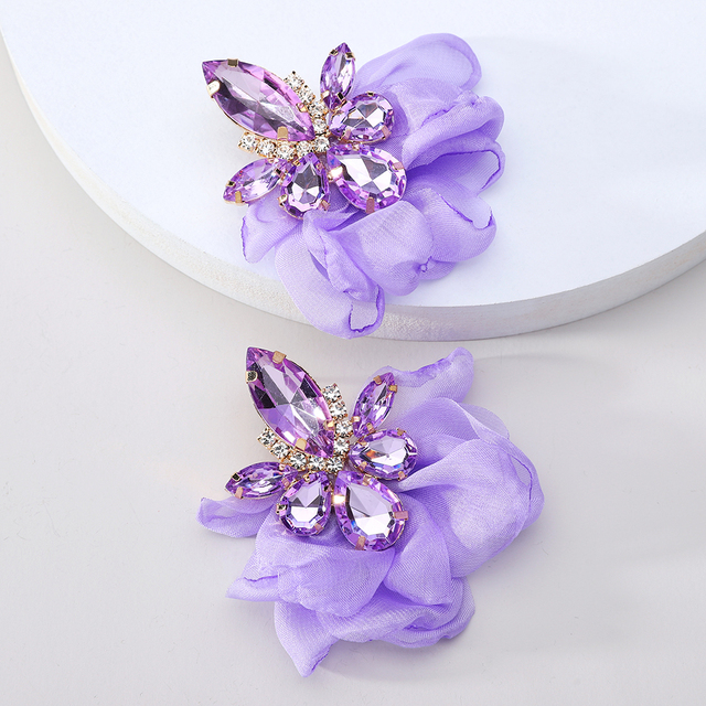 Glamorous earrings featuring rhinestones and delicate floral motifs