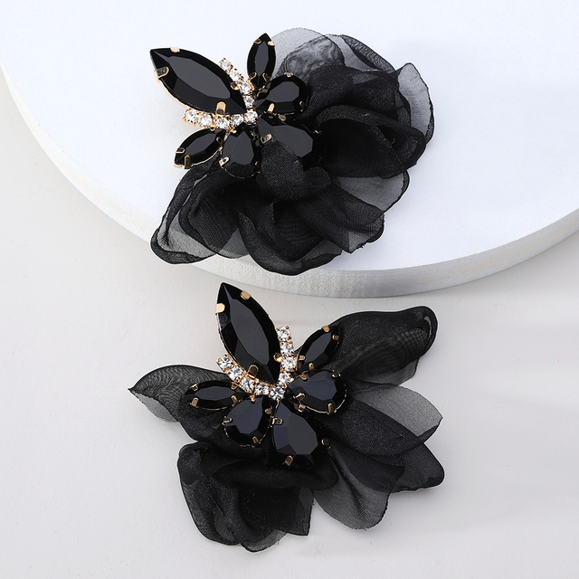 Glamorous earrings featuring rhinestones and delicate floral motifs