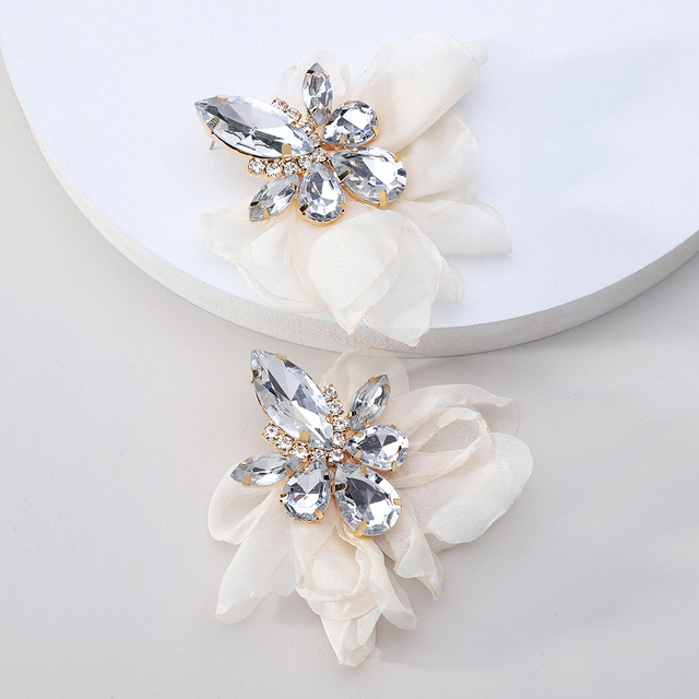 Glamorous earrings featuring rhinestones and delicate floral motifs