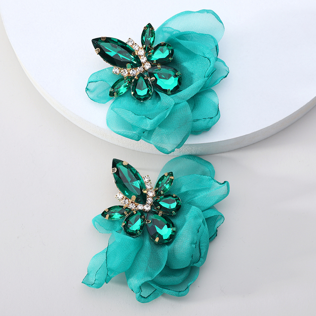 Glamorous earrings featuring rhinestones and delicate floral motifs