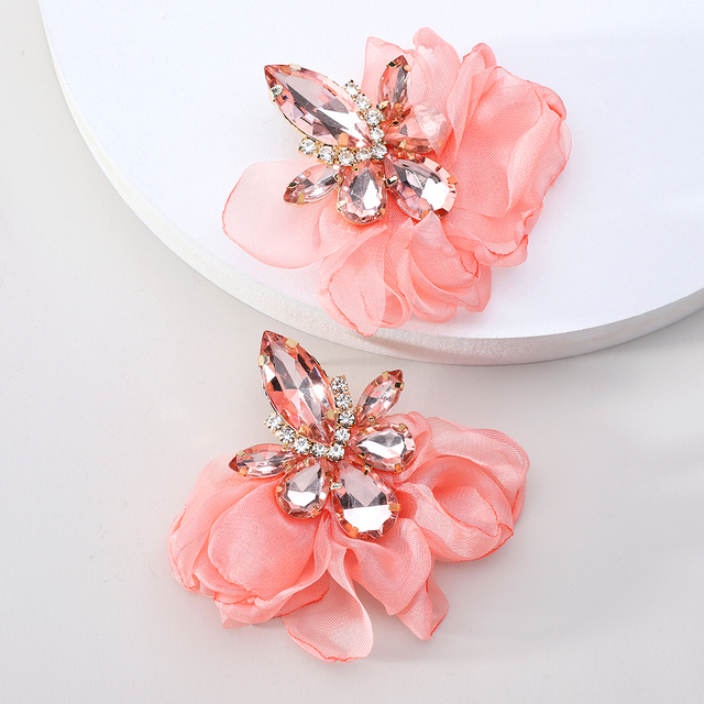 Glamorous earrings featuring rhinestones and delicate floral motifs
