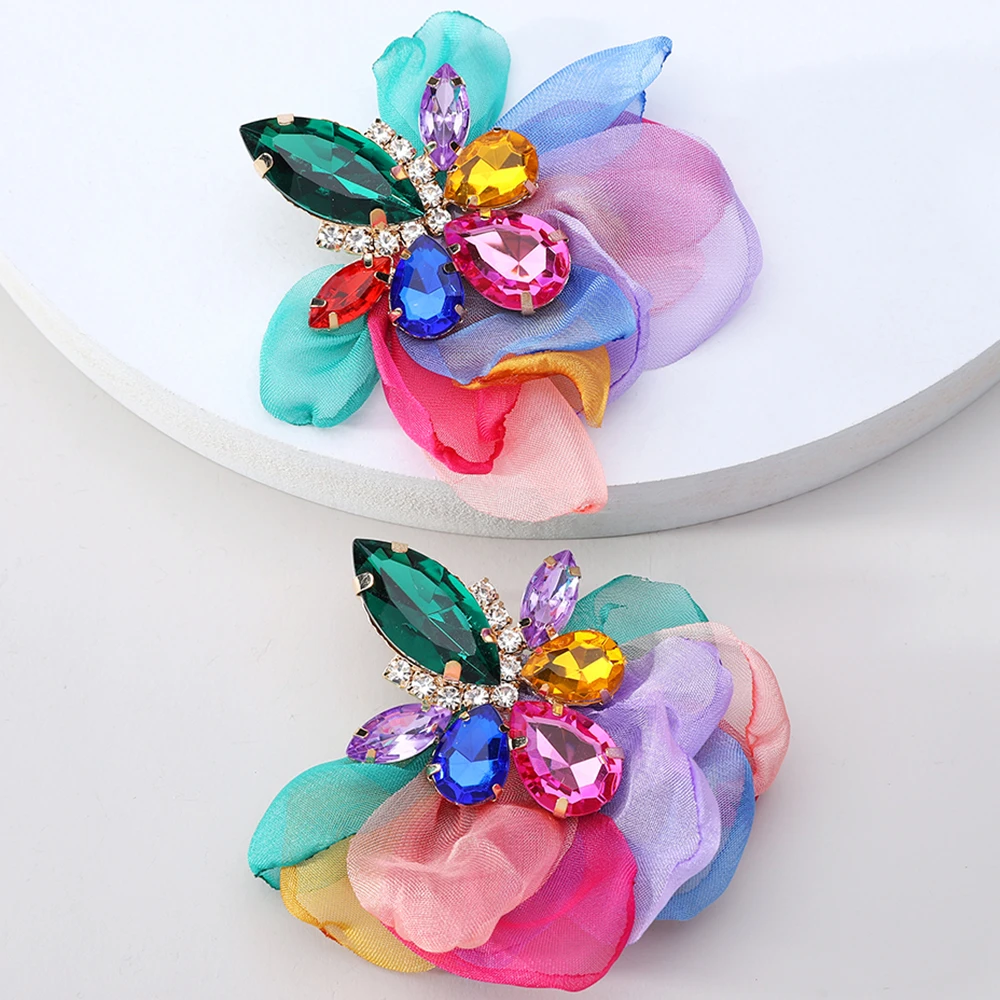 Glamorous earrings featuring rhinestones and delicate floral motifs