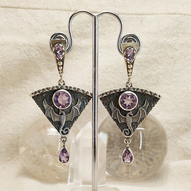 Dark amethyst bat earrings with an elegant vintage design