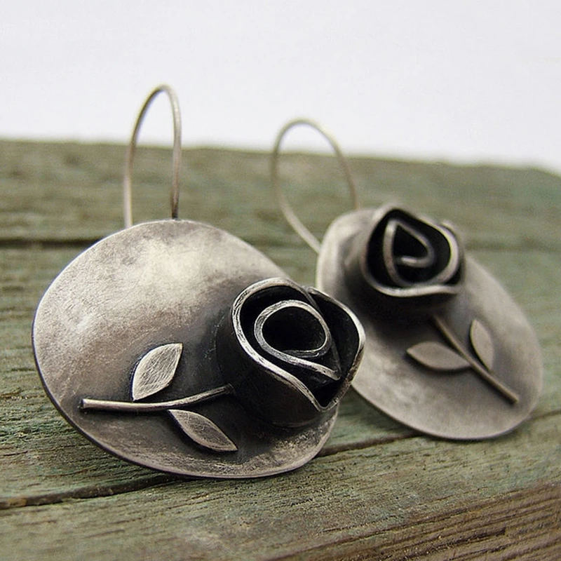 Vintage-style blackened metal rose earrings