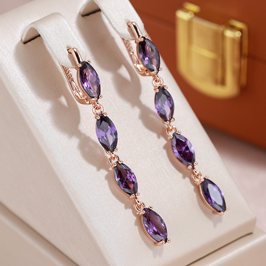 Elegant earrings with teardrop-shaped purple cubic zirconia stones