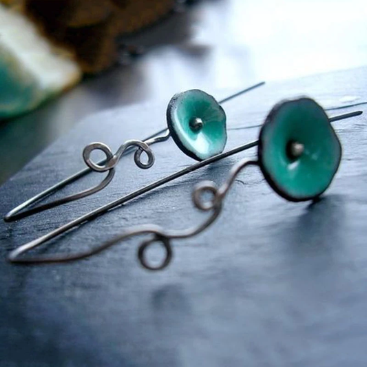 Flower earrings with green enamel and elegant wire detailing