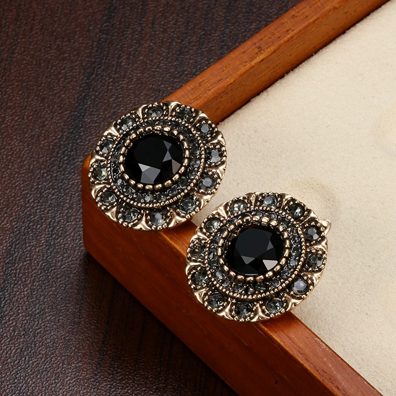 Eye-catching vintage earrings with black crystals and an antique finish