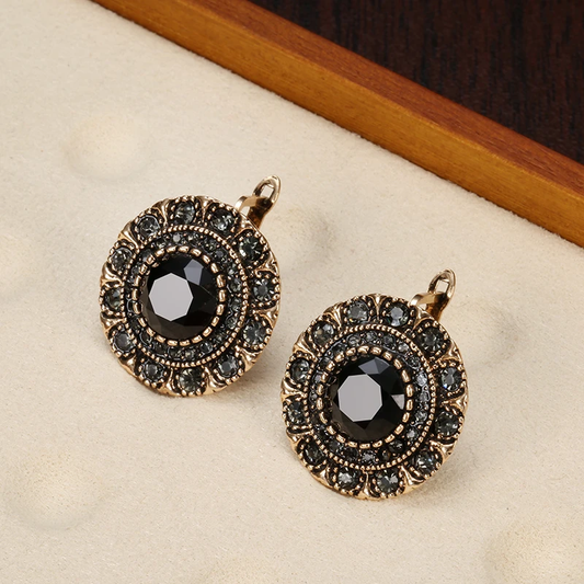 Eye-catching vintage earrings with black crystals and an antique finish