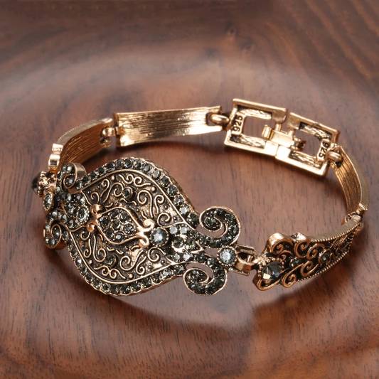 Antique bracelet with filigree detailing and black crystals