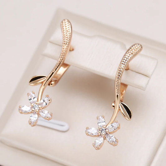 Delicate earrings with sparkling floral crystals and elegant leaf detailing
