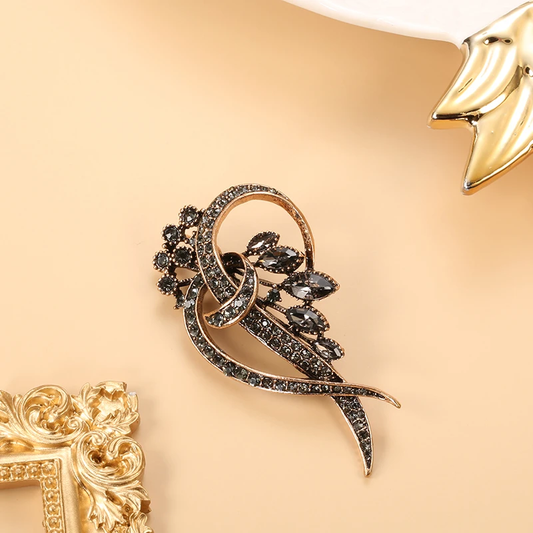 Elegant Vintage Brooch with Rhinestones and Leaf Motif