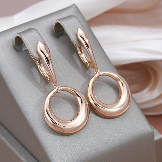 Elegant rose gold-coloured earrings with sparkling cubic zirconia stones and a stylish design