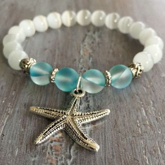 Nautical bracelet with a starfish pendant and blue glass beads