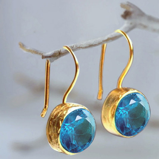 Vintage stud earrings with sparkling blue cubic zirconia stones