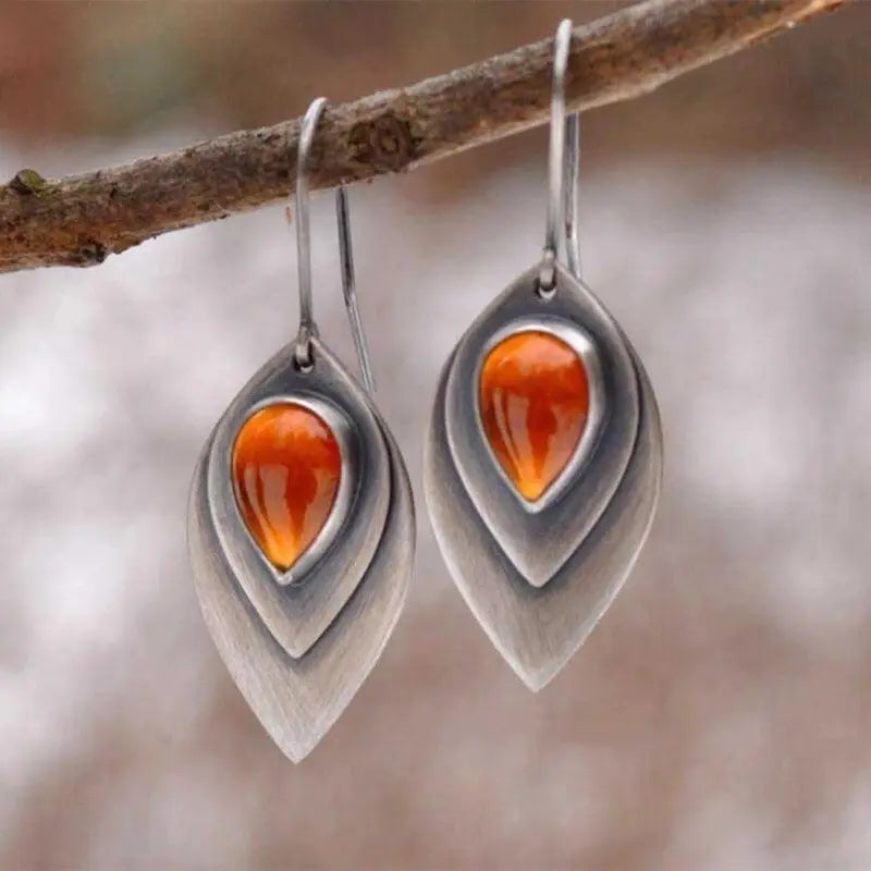 Vintage matt metal earrings with an orange teardrop-shaped stone