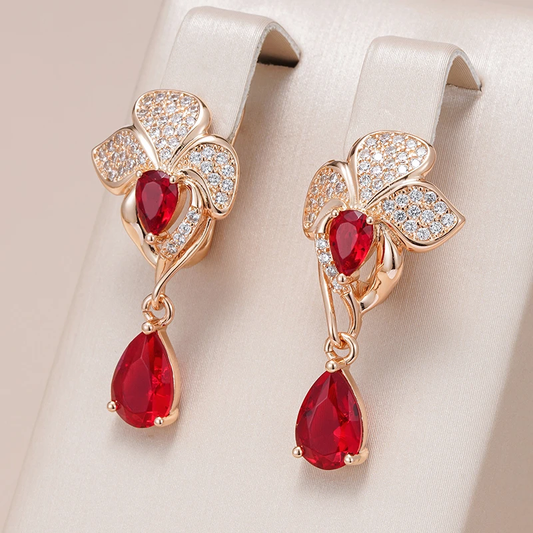 Elegant floral earrings with cubic zirconia and teardrop-shaped red stones