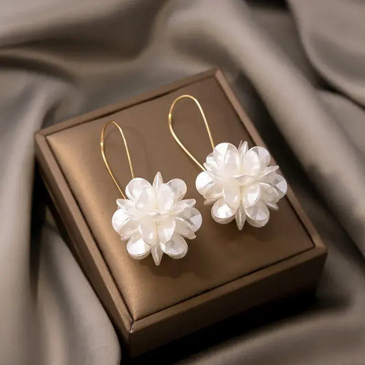 Elegant white flower earrings with a delicate mother-of-pearl sheen