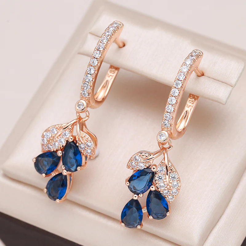 Elegant earrings with blue teardrop-shaped crystals and sparkling cubic zirconia stones