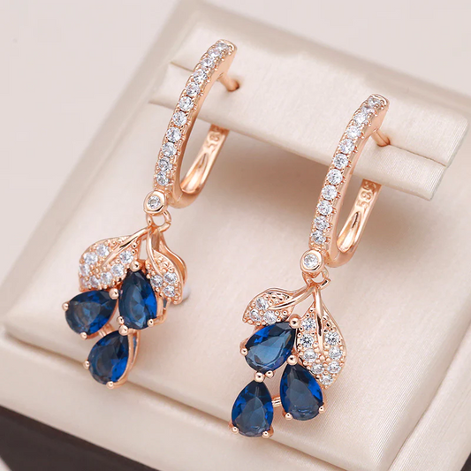 Elegant earrings with blue teardrop-shaped crystals and sparkling cubic zirconia stones