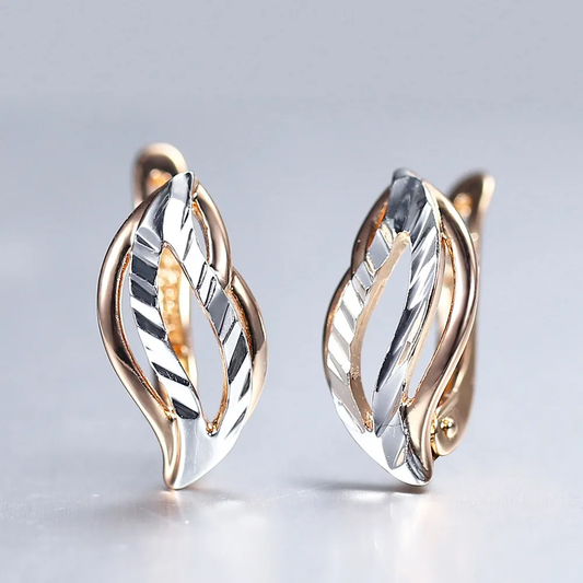 Elegant two-tone earrings featuring a design of sparkling leaves
