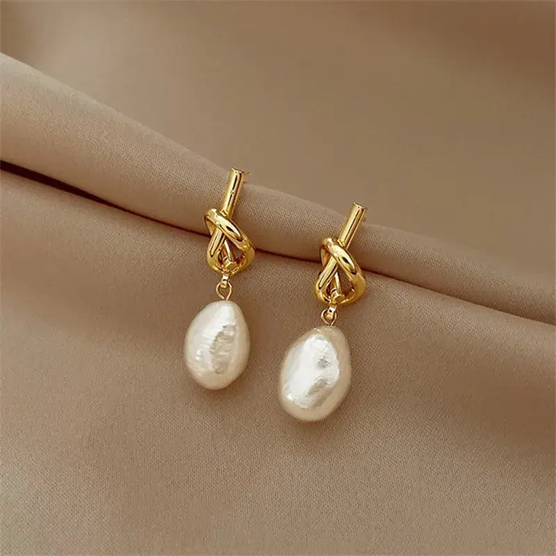 Elegant knotted earrings with white freshwater pearls