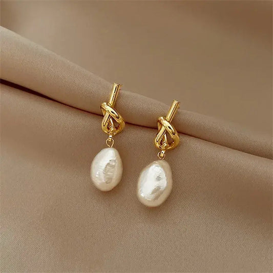 Elegant knotted earrings with white freshwater pearls