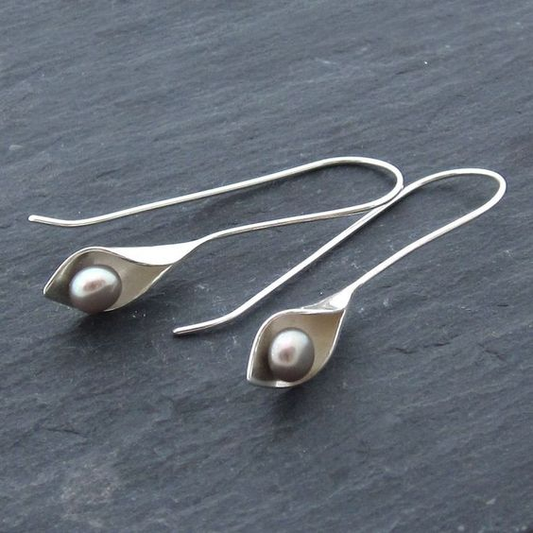 Elegant earrings with a leaf-shaped design and dark freshwater pearls