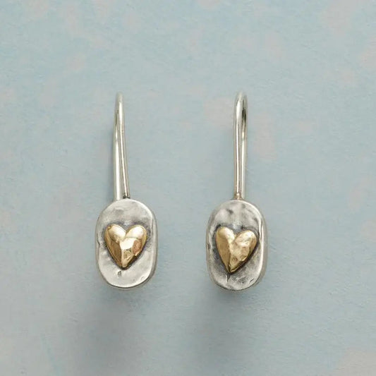 Vintage heart-shaped earrings with an elegant precious metal finish
