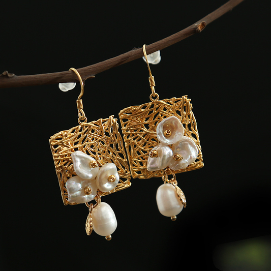 Elegant earrings featuring freshwater pearls and a delicate vintage design
