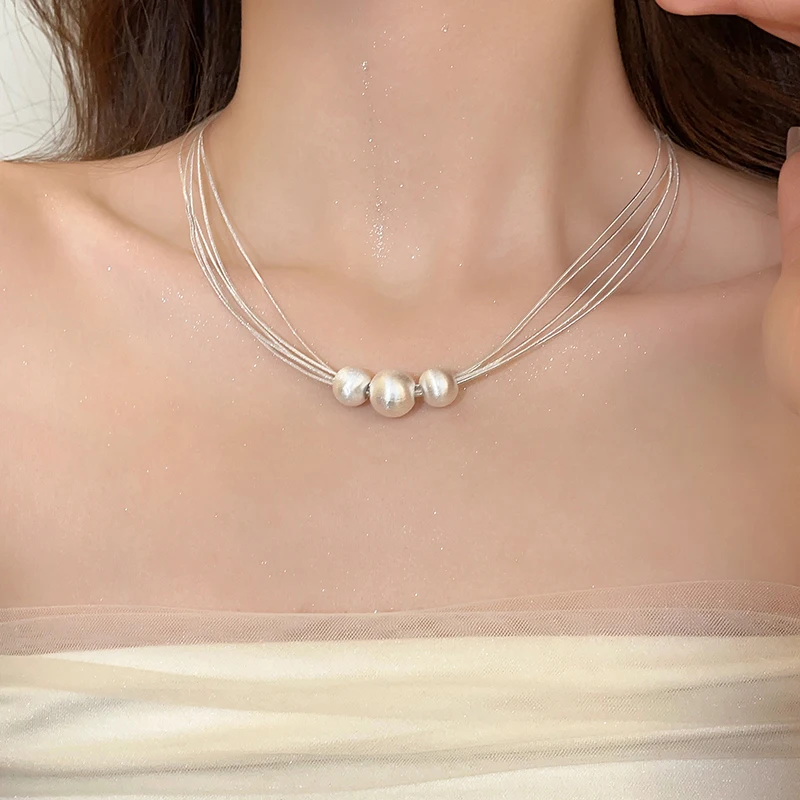 Elegant Pearl Choker: Multi-Row Necklace with Shimmering Balls