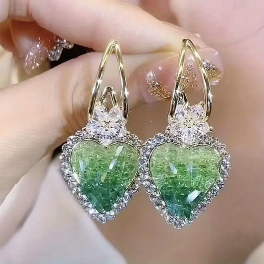 Sparkling heart-shaped earrings with green cubic zirconia and delicate flowers