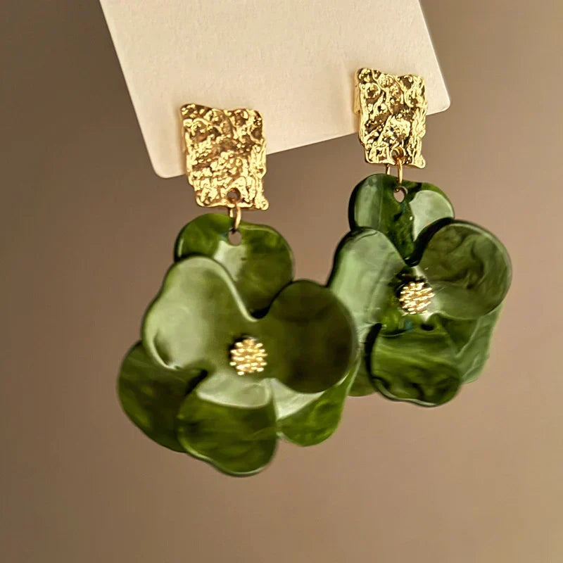 Vintage green floral earrings with textured metal detailing