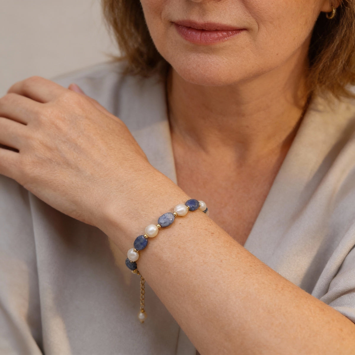 An elegant bracelet featuring freshwater pearls and sodalite gemstones