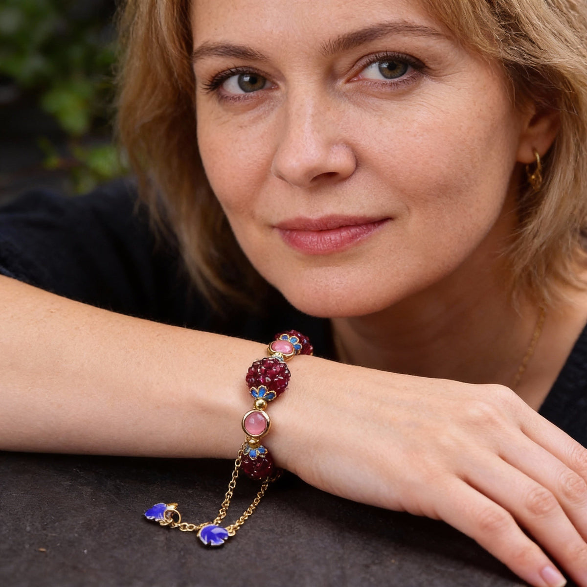 An exquisite garnet bracelet with rose quartz and blue enamel