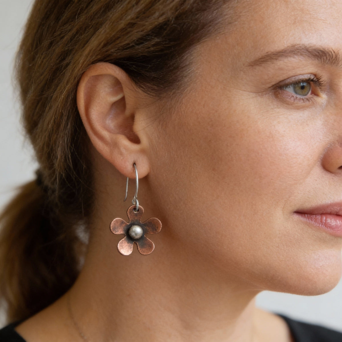Handmade copper flower earrings with rustic bead detailing
