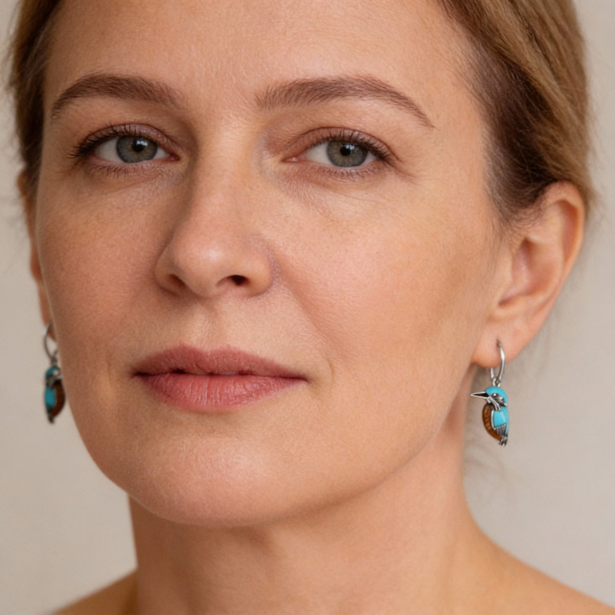 Turquoise blue bird earrings with an animal motif and an elegant design