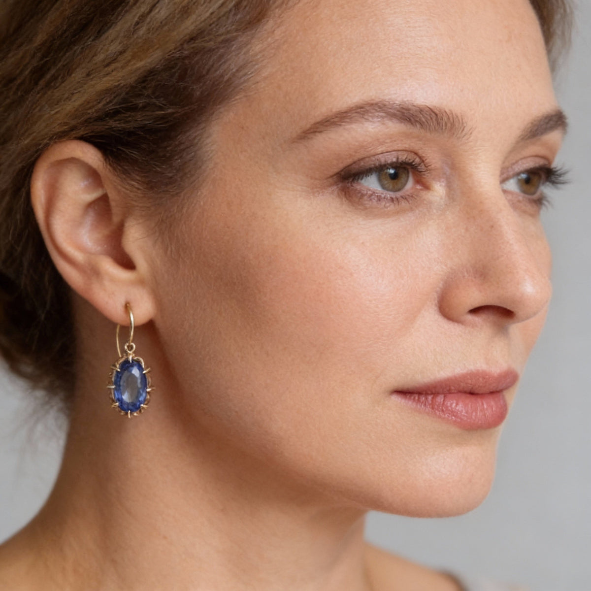 Elegant Hook Earrings with Faceted Oval Blue Gemstone