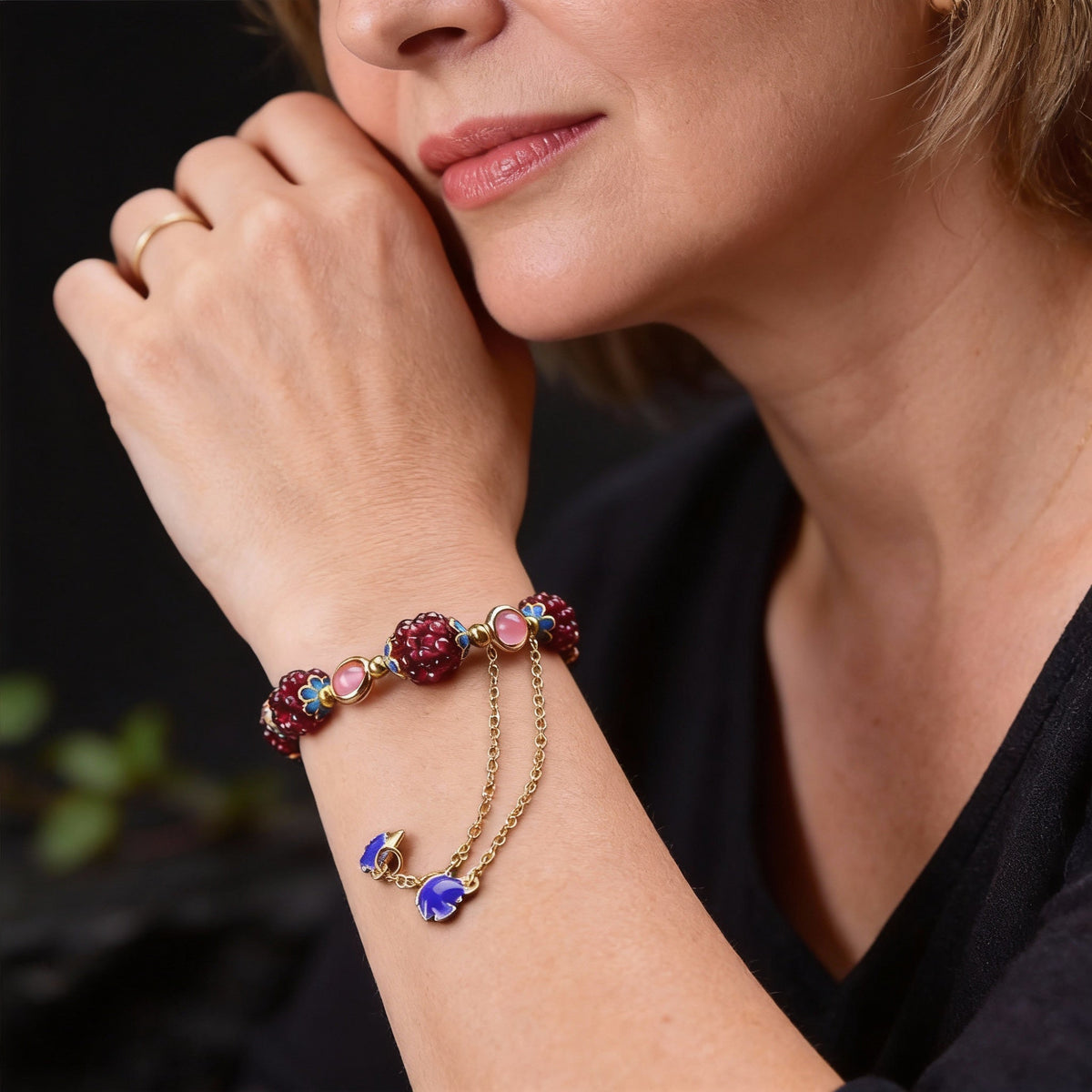 An exquisite garnet bracelet with rose quartz and blue enamel