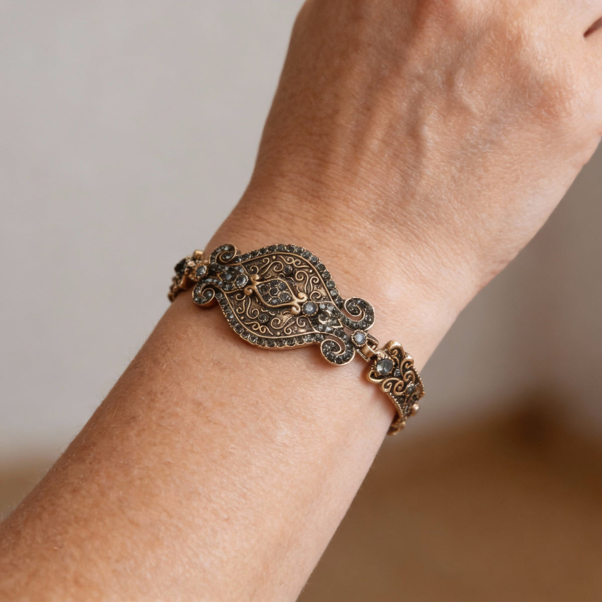 Antique bracelet with filigree detailing and black crystals