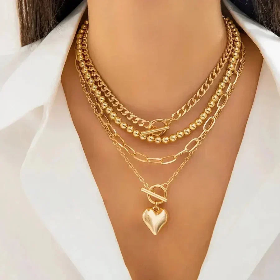 Multi-Layer Statement Necklace with Heart Pendant and Mixed Chains
