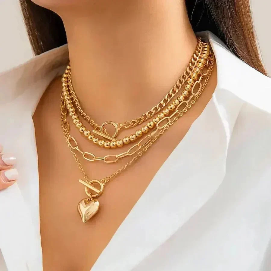 Multi-Layer Statement Necklace with Heart Pendant and Mixed Chains