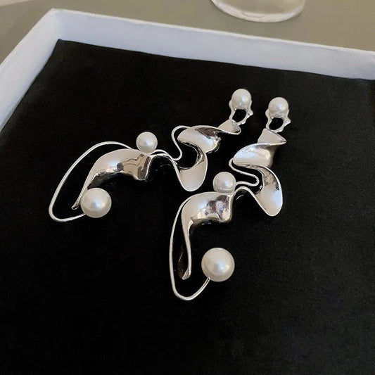 Eye-catching abstract earrings with pearls for a modern, elegant look