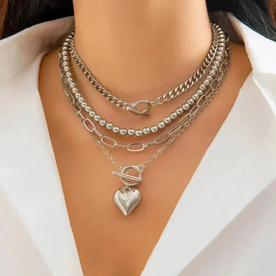 Multi-Layer Statement Necklace with Heart Pendant and Mixed Chains