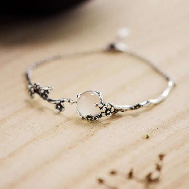 Vintage bracelet with rose quartz and delicate floral tendrils