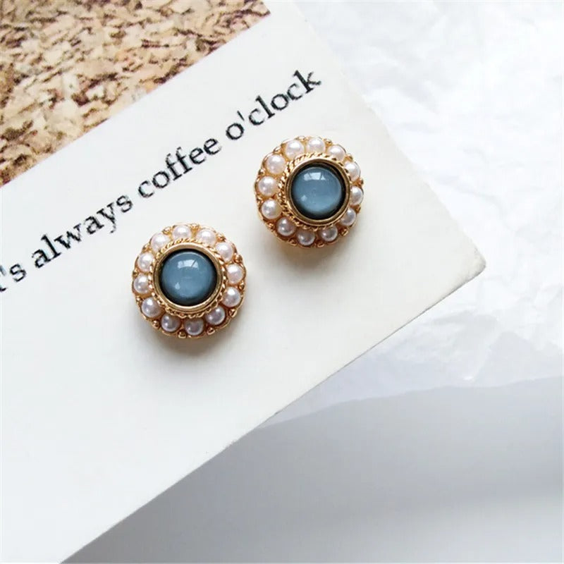 Vintage earrings with cat's eye stones and delicate pearls