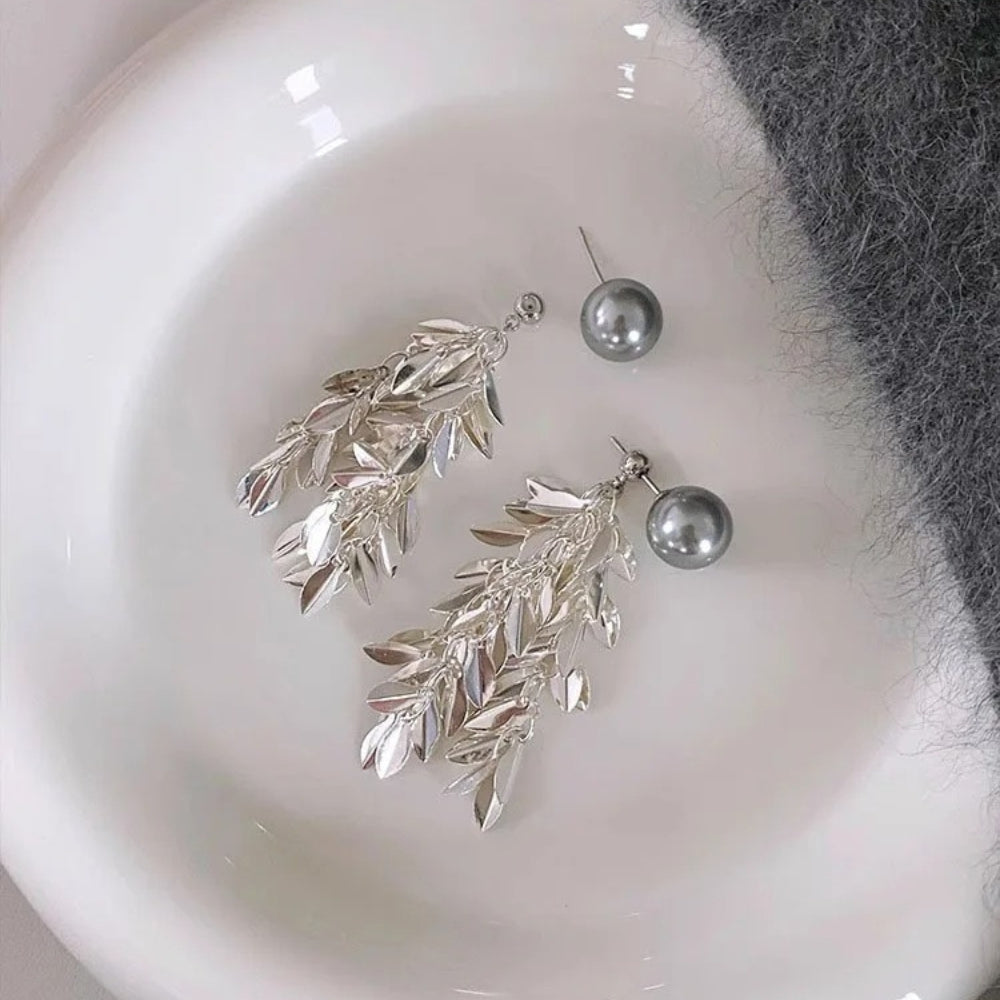 Elegant earrings featuring leaves and grey pearls