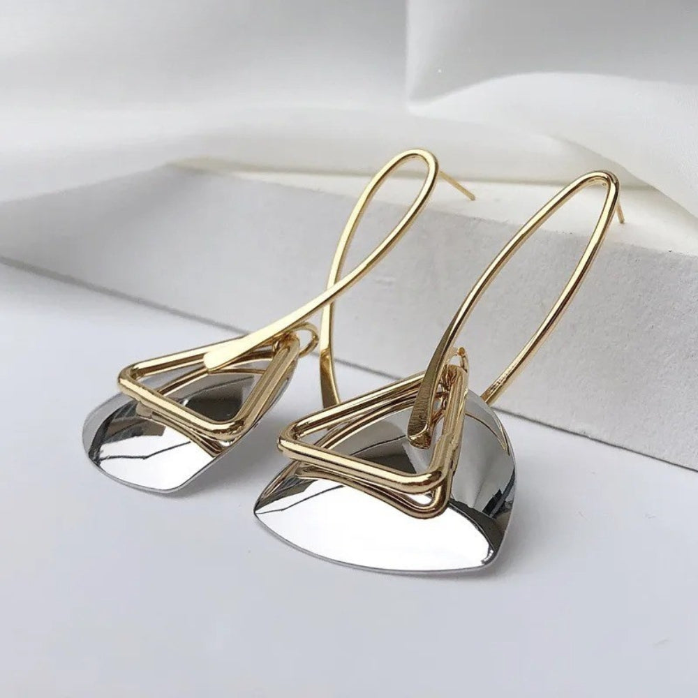 Elegant and eye-catching earrings featuring geometric metal elements and a shiny finish