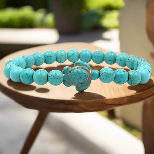 Natural stone bracelet with a turquoise tortoise pendant and beads